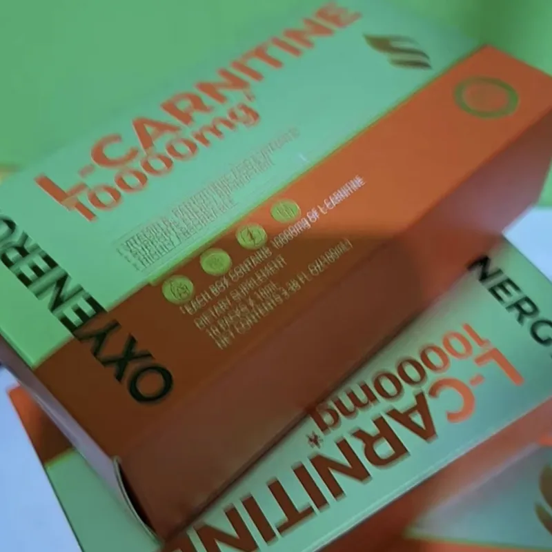 Buyer's photo — two L-Carnitine 10000mg boxes stacked on a green surface