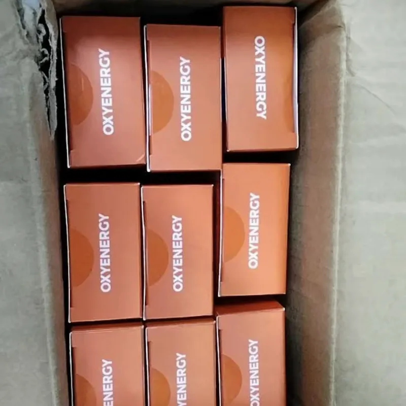 Buyer's photo — nine OXYENERGY boxes packed inside a shipping carton