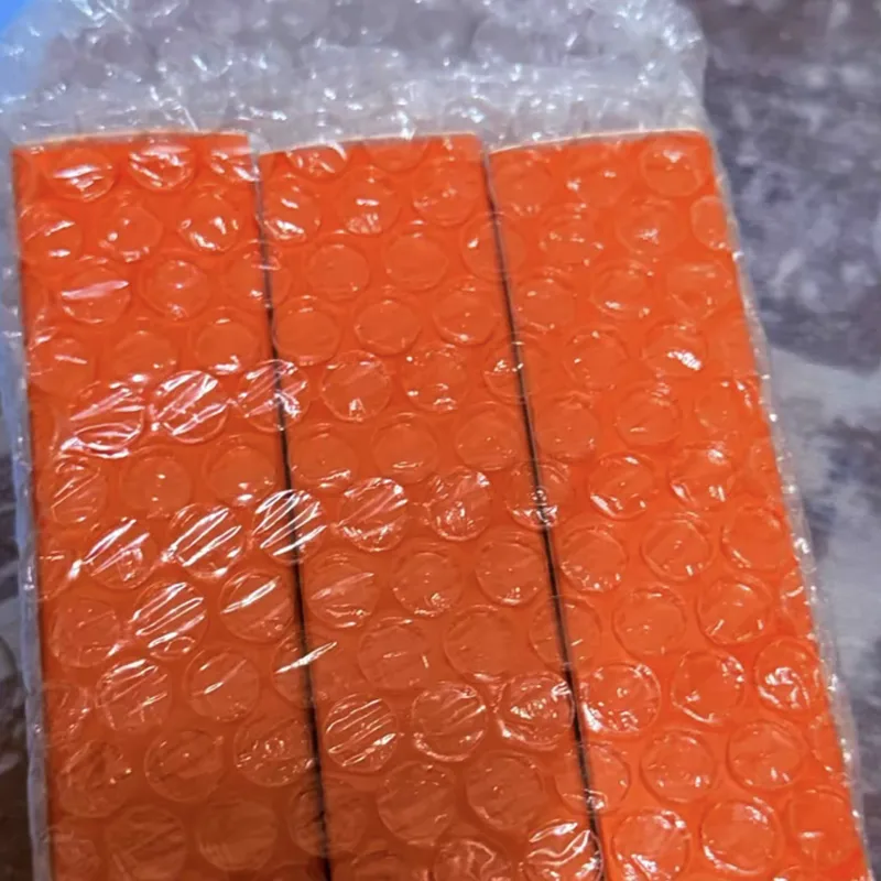 Buyer's photo — three orange boxes still in bubble wrap as they arrived