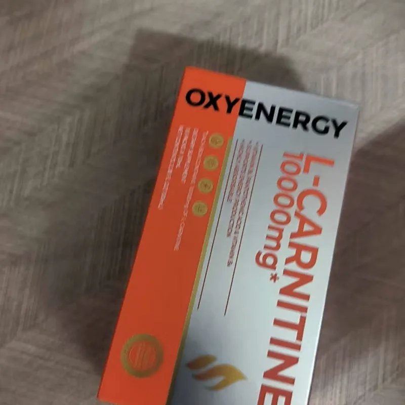 Buyer's photo — an L-Carnitine 10000mg box on a wooden floor