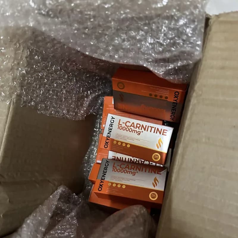 Buyer's photo — several OXYENERGY boxes wrapped in bubble wrap inside a shipping carton