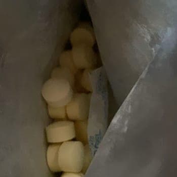 Buyer’s photo looking down into an opened pouch of chewable tablets
